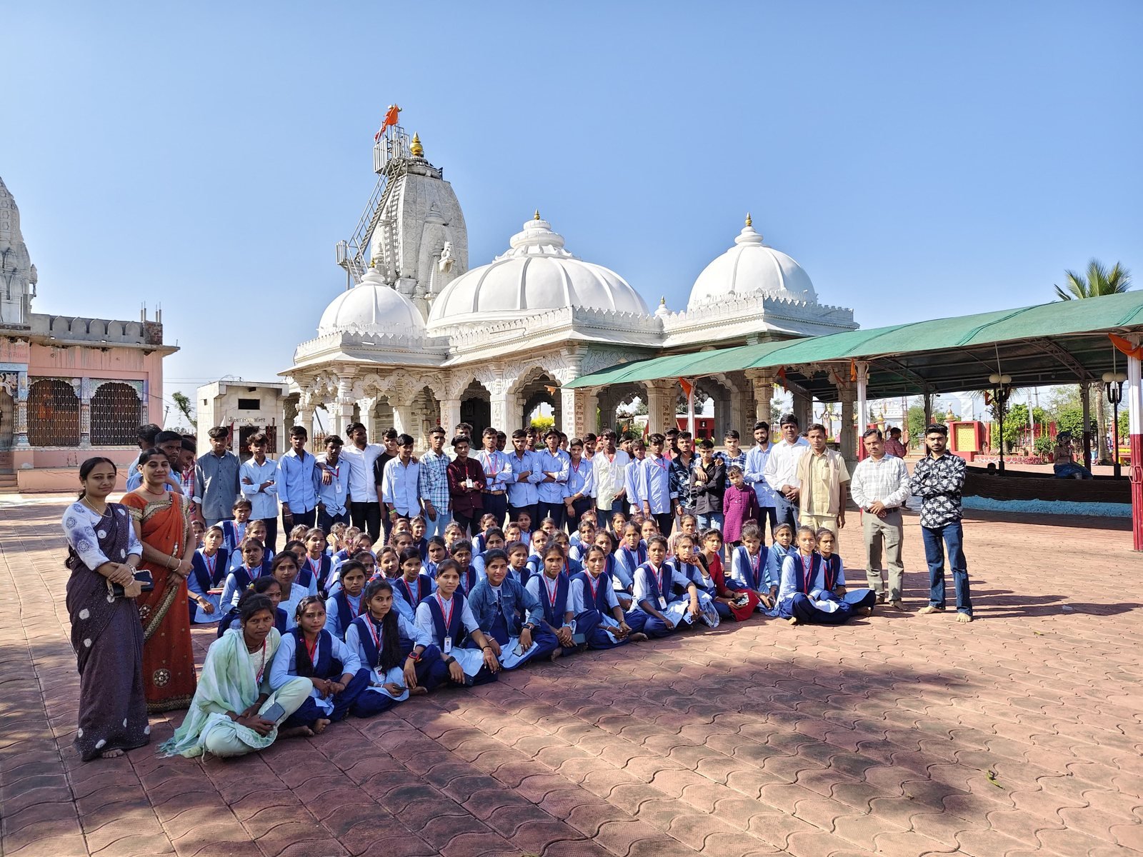 Students inside a marble temple complex during the educational excursion