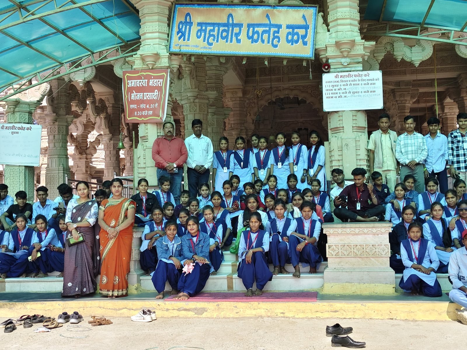 Students and faculty outside a white-domed temple